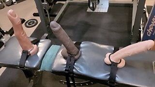 Sissy  squats with three big Mr Hankeys toys